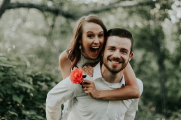 woman-riding-on-back-of-man.jpg woman riding on back of man
